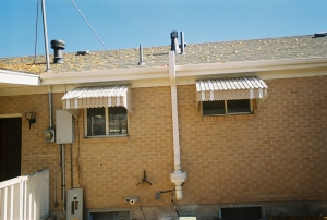 radon mitigation system in back of condo building RDS Environmental Colorado