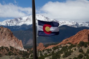 colorado flag with mountains in background